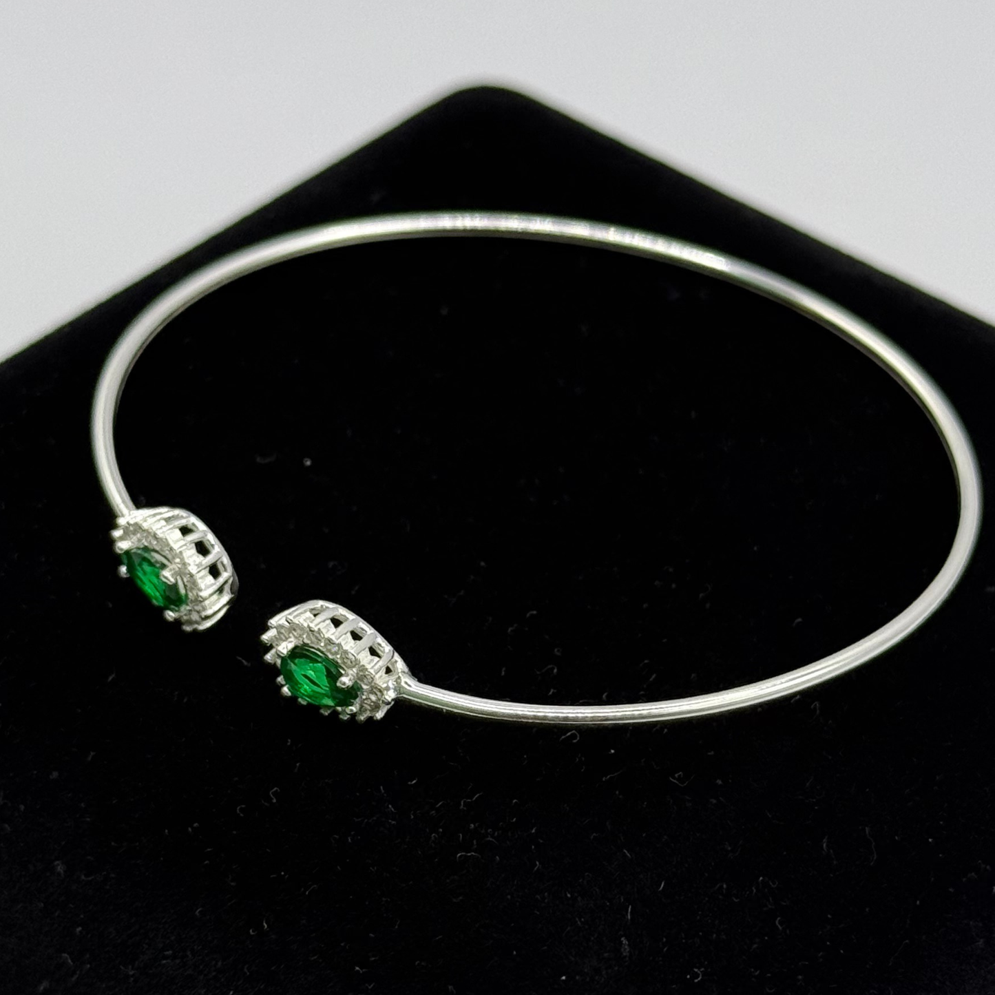 GREEN OVAL STONE WITH CZ DIAMONDS ON SILVER BANGLE Oppulence