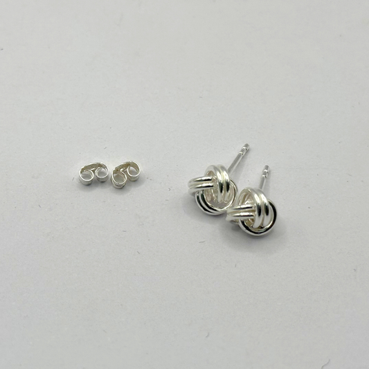 SILVER WOOLMARK STUD EARRINGS Oppulence